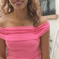 black woman in hot pink bodycon dress wearing the black South sea pearll pendant necklace from the wandering jewel