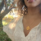 black woman in white dress in forrest wearing the 7 diamond pendant necklace from the wandering jewel