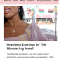 Glamour magazine article of the wandering jewell featuring a black woman with long brown hair wearing the graylatto ice cream necklace and matching earrings from the wandering jewel