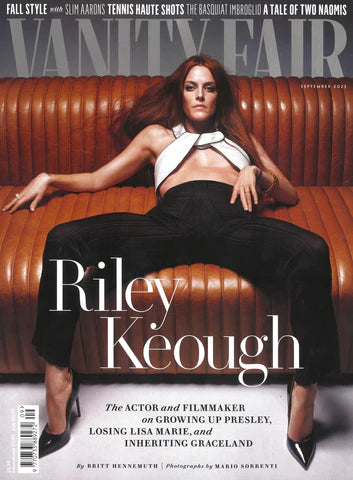 cover of vanity Fair magazine featuring actress riley keough laying on a brown sofa and featuring jewelry from the wandering jewel