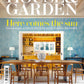 cover of home and garden magazine featuring a minimalist living room with a brown table and chairs and jewelry from the wandering jewel