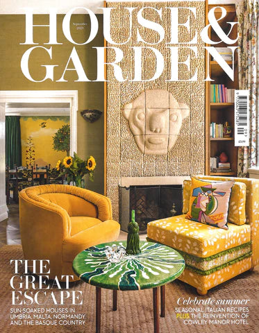 the cover of house and Garden magazine featuring  a yellow living room with yellow chairs and an insert jewelry feature featuring the wandering jewel