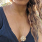 video of black woman with curly hair wearing the 7 diamond compass necklace from the wandering jewel