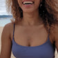 video of black woman on a beach in purple bikini wearing the 7 diamond heart pendant from the wandering jewel