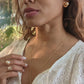 video of black woman in garden wearing white dress and smiling while wearing the Large oversized South sea pearl diamond ring from the wandering jewel