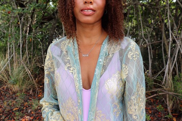 woman in forest wearing silver mutha necklace