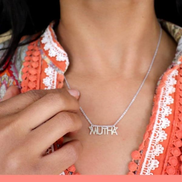 woman wearing silver mutha necklace