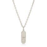 18K solid gold Pill shaped pendant necklace with a cross on the bottom half of the pill from the wandering jewel