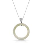 white jade ring on a white gold chain with white gold  7 tier bail  from the wandering jewel