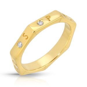 Septagon shaped Gold ring with the letters spoiled set between white diamonds