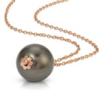 18K solid gold pearl pendant showcasing bead cap on the bottom of the pearl from the wandering jewel