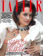 tuppence Middleton on the cover of Tatler magazine n a white dress wearing an emerald and pearl choker