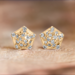 Gold Pentagon shaped diamond stud earrings from the wandering jewel