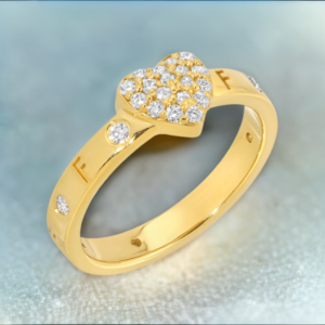 Gold and diamond Disengagement Ring with the word fuck off engraved, the ring also features a Gold heart in the middle of the ring