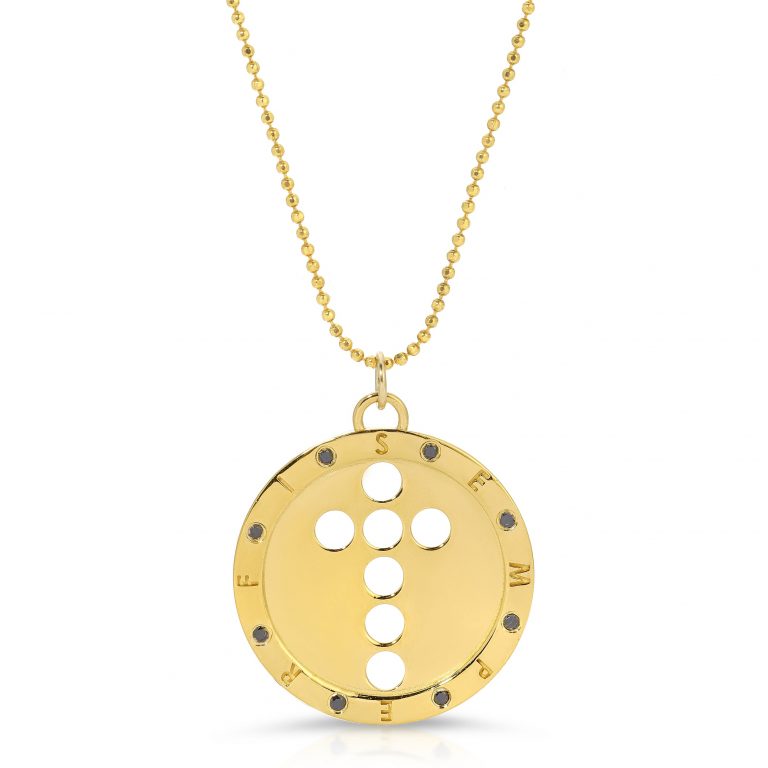 gold and black diamond semper Fi pendant from the wandering jewel. The pendant also has a cutout cross in the middle of it made of 7 circles