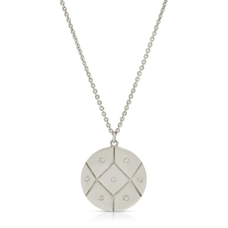 Gold coin necklace with seven diamonds arranged in a circular pattern